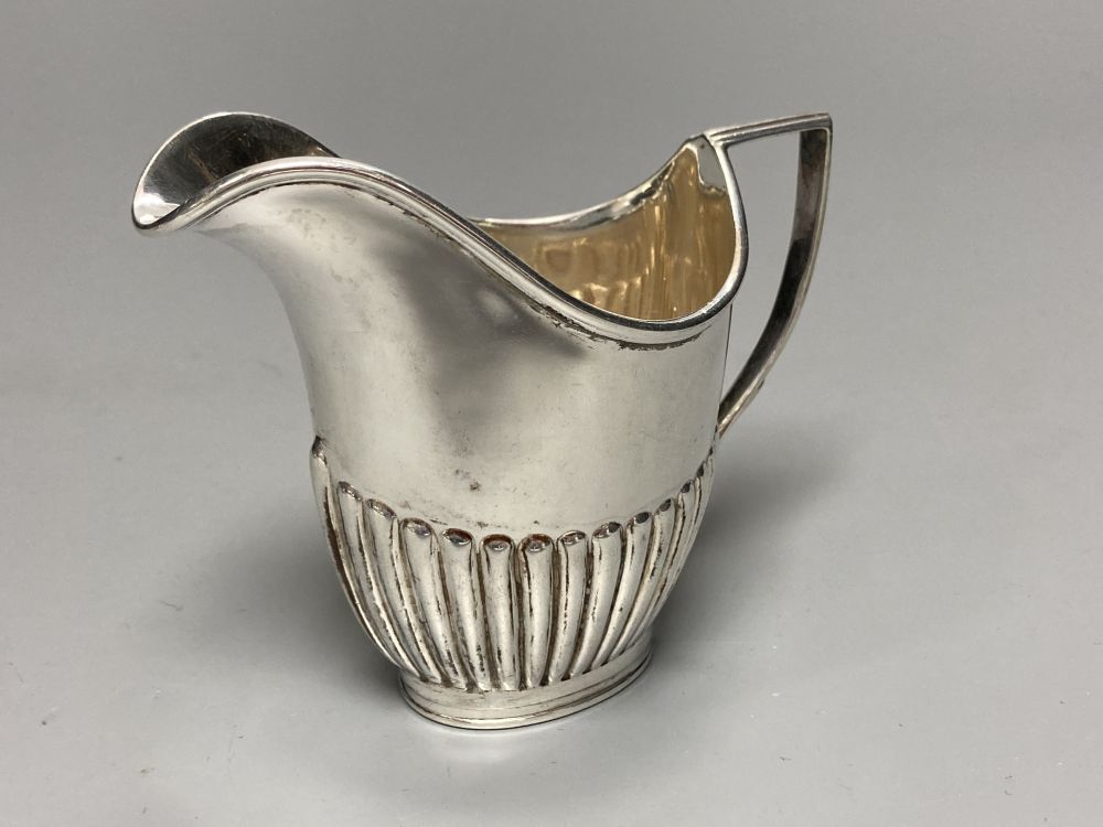 A late Victorian small silver cream jug, Birmingham, 1898, 57mm and a similar silver cream jug, London, 1891,